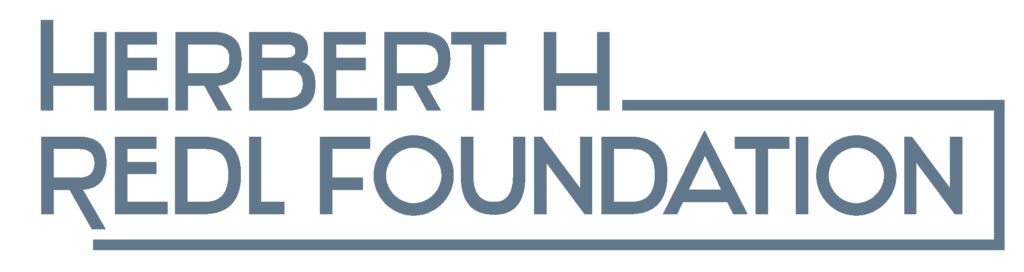 Blue Lettering of Herbert H REDL Foundation with a white background