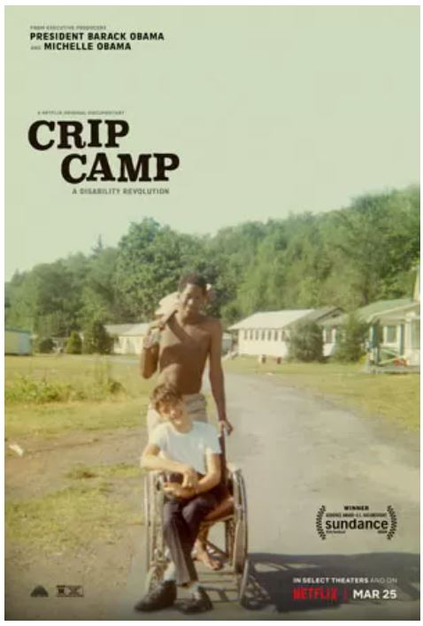 Movie poster CRIP CAMP: A DISABILITY REVOLUTION. Two young smiling teen boys together, one teen who is black, holding a guitar over his sholder, standing behind the other teen who is white, sitting in a wheelchair.