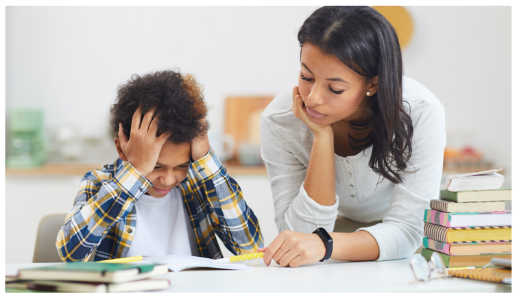 image of a child frustrated with his school work and a parent calmly helping him